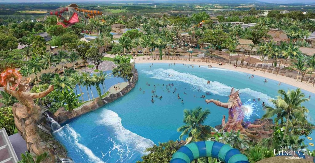 Biệt thự Sun Bắc Ninh - Điểm đến đầu tư cao cấp giữa lòng thành phố 4 Hình ảnh toàn cảnh khu vui chơi nước tại Sun Bắc Ninh, với hồ bơi sóng lớn, tượng thần biển khổng lồ, cây cọ xanh mát, và các đường trượt nước đầy màu sắc, tạo nên không gian giải trí độc đáo.